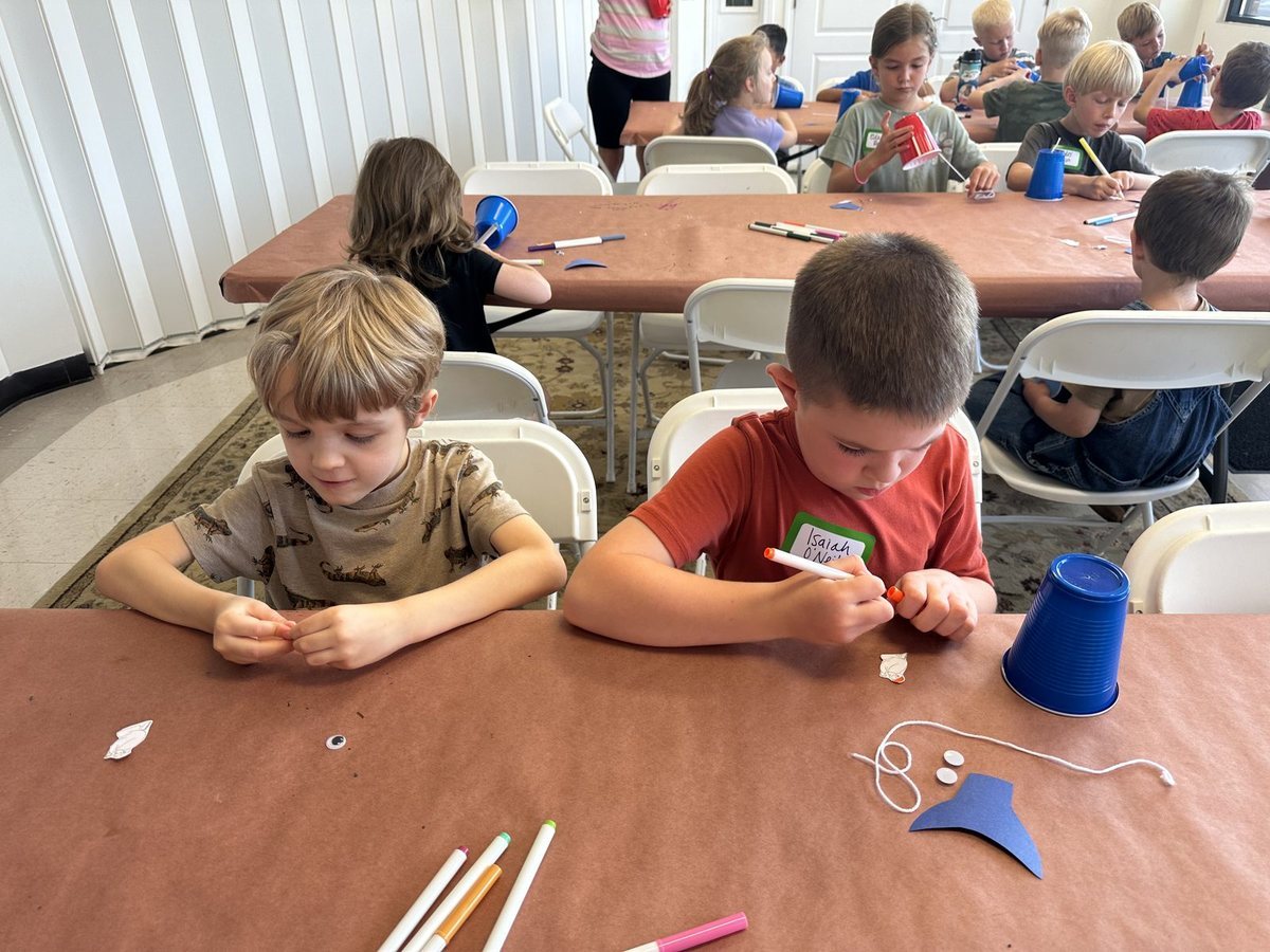 Children working on a craft together at Vacation Bible School
