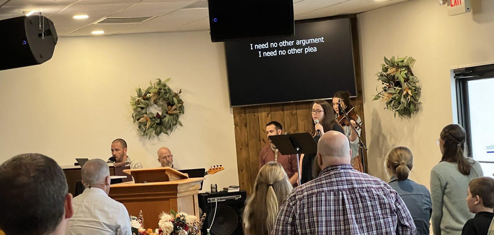 Church members talking together after a gathering